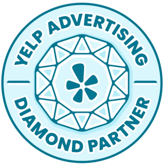 Yelp Advertising Diamond Partner badge: teal circular logo with geometric center and text around the edge.